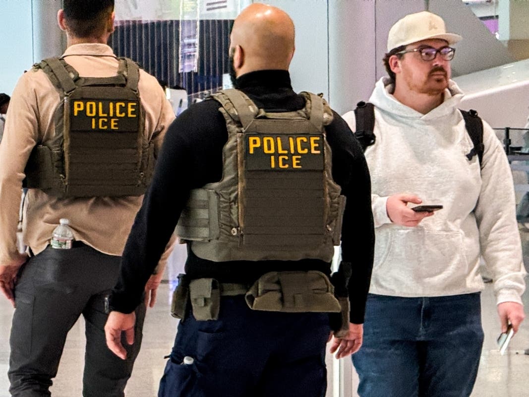 Federal immigration agents walk through Terminal A at Newark International Airport (EWR) in New Jersey, Tuesday, March 24, 2026.