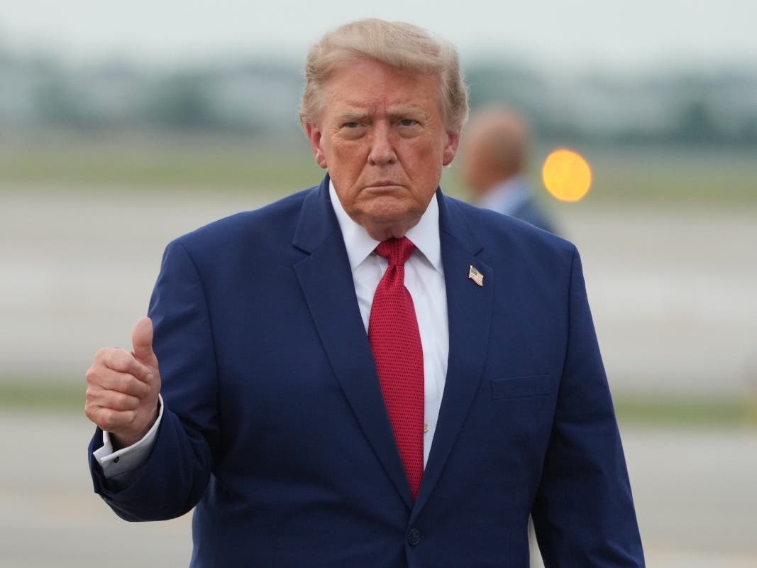 President Donald Trump walks from Marine One to board Air Force One at Cleveland Hopkins International Airport in Cleveland, Tuesday, Aug. 11, 2026.