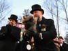 Groundhog Club handler A.J. Dereume holds Punxsutawney Phil, the weather prognosticating groundhog, during the 140th celebration of Groundhog Day on Gobbler's Knob in Punxsutawney, Pa., Monday, Feb. 2, 2026.