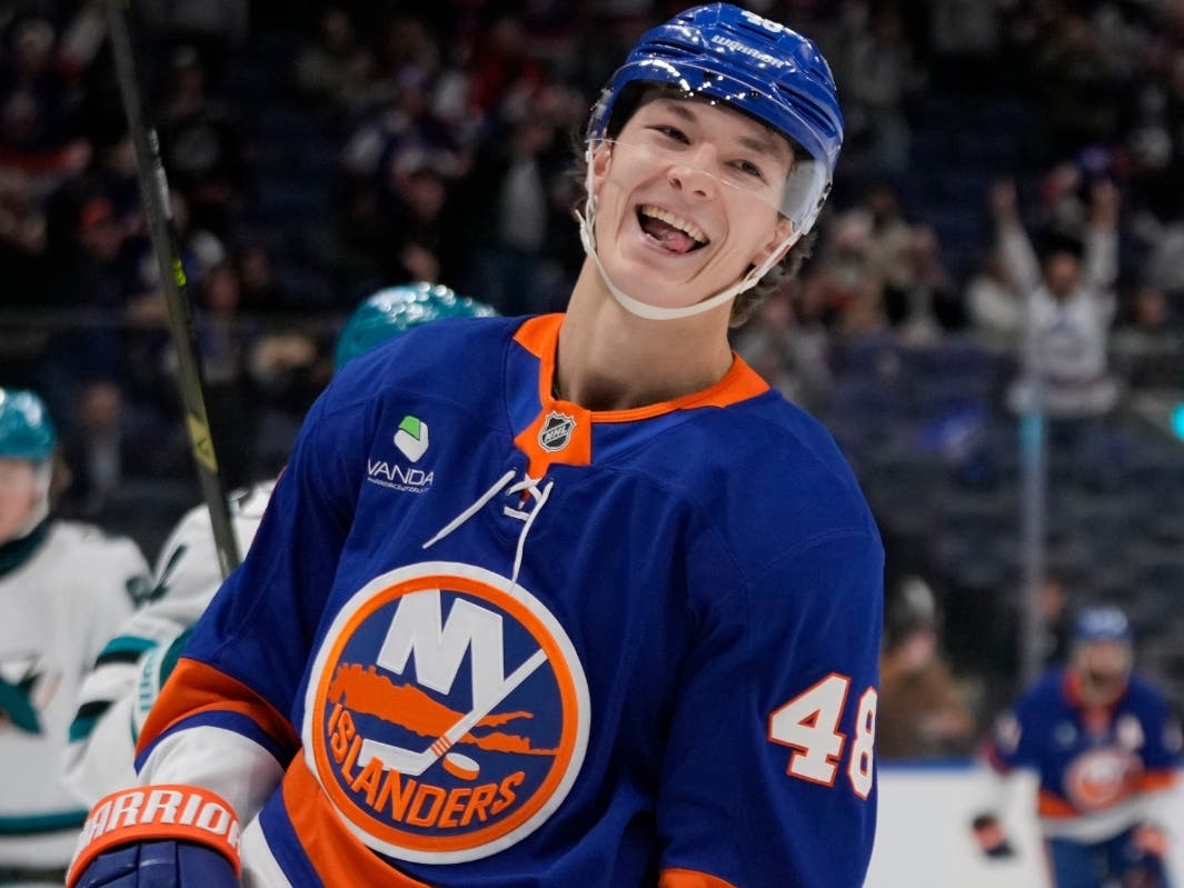 New York Islanders' Matthew Schaefer (48) smiles after scoring a goal during the second period of an NHL hockey game against the San Jose Sharks, Oct. 21, 2025, at UBS Arena in Elmont, N.Y.