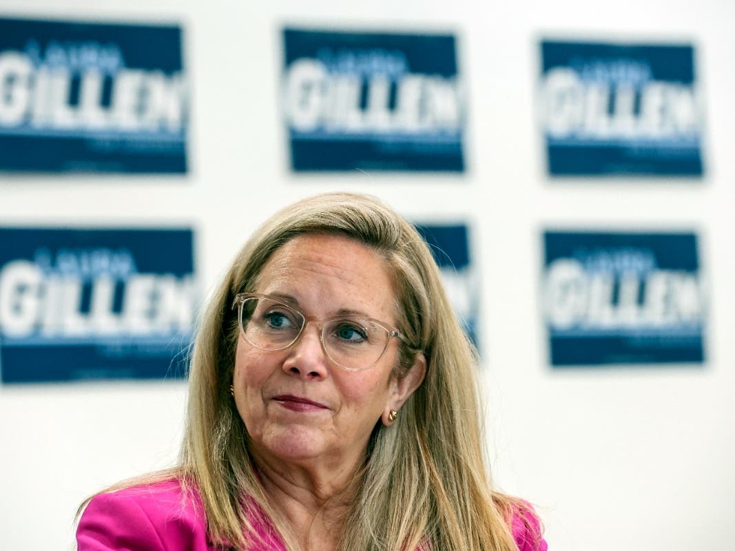 Laura Gillen, Democratic candidate for New York's 4th Congressional District, listens during a roundtable discussion outlining her policy platform to lower healthcare costs for Latino families, Thursday, Oct. 24, 2024, in Freeport, N.Y.