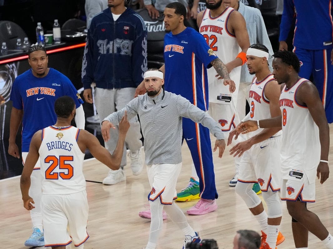 The New York Knicks celebrate after Game 1 of the NBA Finals basketball series against the San Antonio Spurs, June 3, in San Antonio.