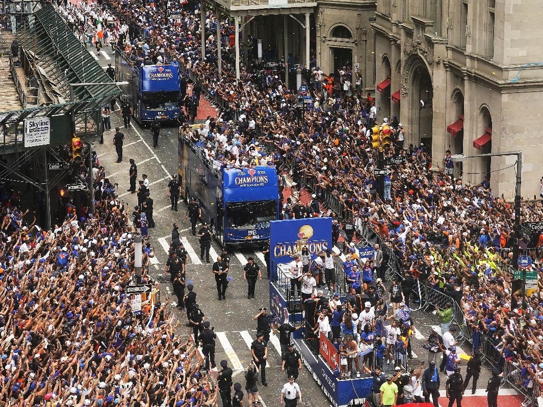 Crowds fill the sidewalks during the NBA Champion New York Knicks ticker-tape parade on Broadway, in New York's "Canyon of Heroes," on June 18.