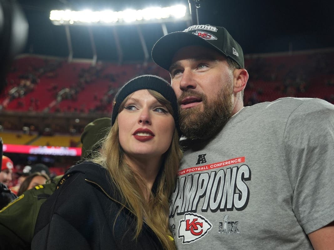 Kansas City Chiefs tight end Travis Kelce, right, is congratulated by Taylor Swift as they celebrate the Chiefs' victory over the Buffalo Bills in the AFC Championship NFL football game, Jan. 26, 2025, in Kansas City, Mo.