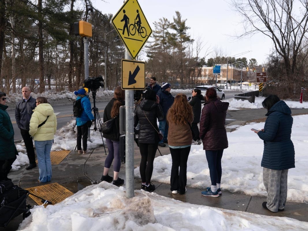 Student is shot in a Maryland high school and another student is in custody, police say People wait outside Thomas S. Wootton High School for students in Rockville Md., Monday, Feb. 9, 2026, after a person was shot inside the school.
