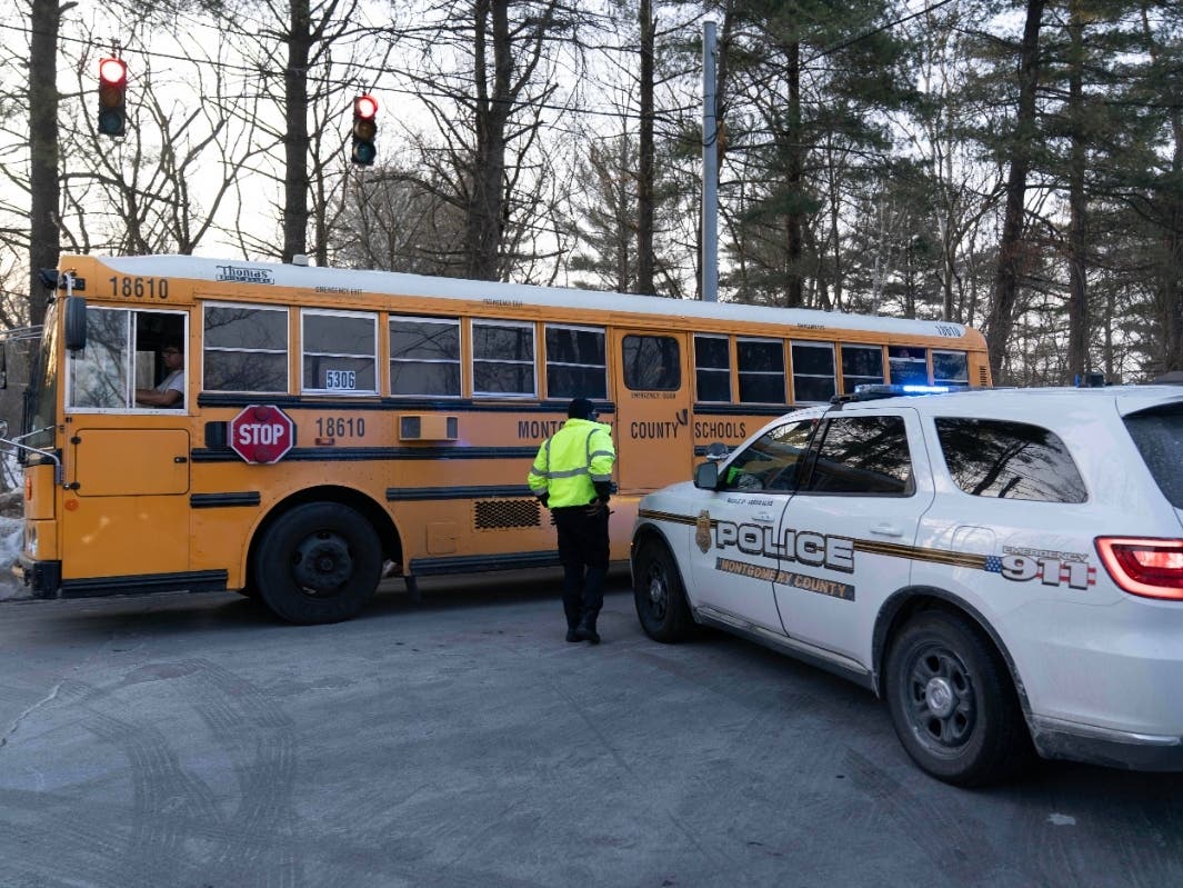 Thomas S. Wootton High School students leave the school in a bus after a lockdown in Rockville, Monday, Feb. 9, 2026, after a person was shot inside the school.