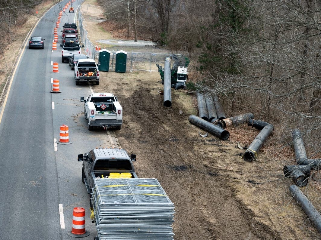 Interceptor pipes lay alongside the C&O Canal where a massive pipe rupture has sent sewage spilling into the Potomac River, in Glen Echo, Md., Friday, Jan. 23, 2026.