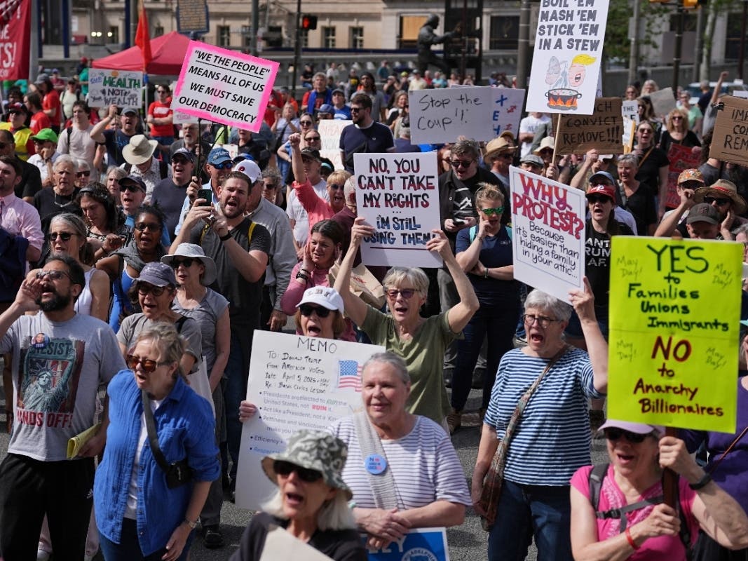 People gather ahead of a May Day demonstration at City Hall in Philadelphia, Thursday, May 1, 2025.