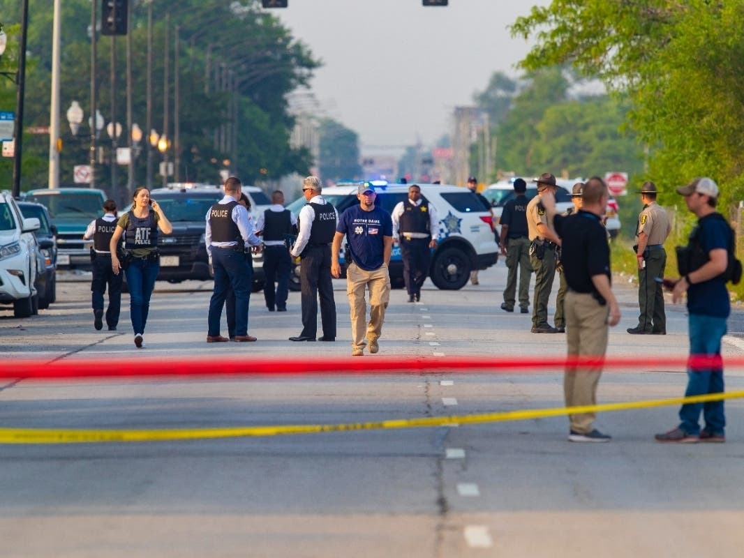 Chicago police and ATF agents work the scene of a shooting on South Ashland Avenue near West 118th Street next to Interstate 57, Wednesday, July 7, 2021. 