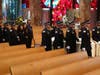 The family of Chicago police Officer Luis Huesca, including his mother Edith Huesca, and his sister, Lily O'Brien, follow his casket inside St. Rita of Cascia Shrine Chapel for his funeral on Monday.