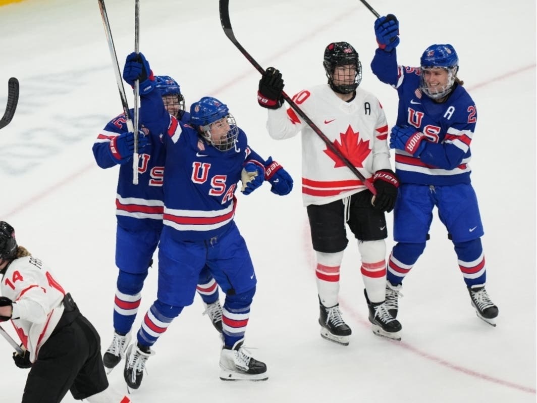 United States' Hilary Knight, center, celebrates after scoring a goal against Canada during the third period of the women's ice hockey gold medal game at the 2026 Winter Olympics, in Milan, Italy.