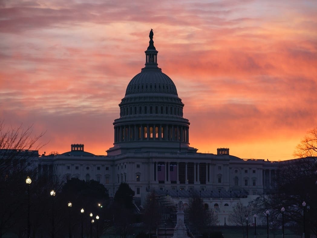 Dawn breaks at the Capitol in Washington as House Speaker Nancy Pelosi (D-CA) called for congressional action to rein in President Donald Trump after inciting last week's deadly assault on the U.S. Capitol.