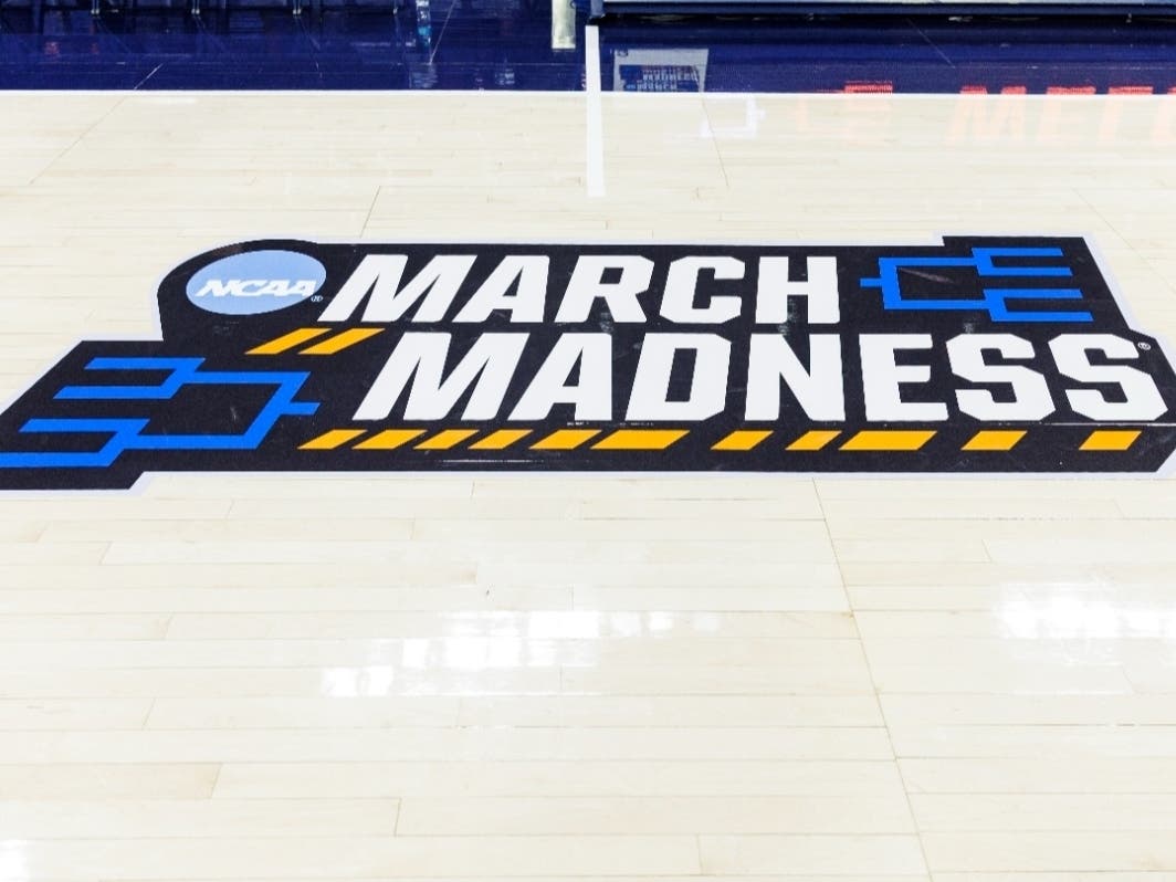 March Madness logo displayed on the court prior to a first-round college basketball game in the NCAA Tournament between Iowa State and Michigan, Friday, March 21, 2025, in South Bend, Ind.