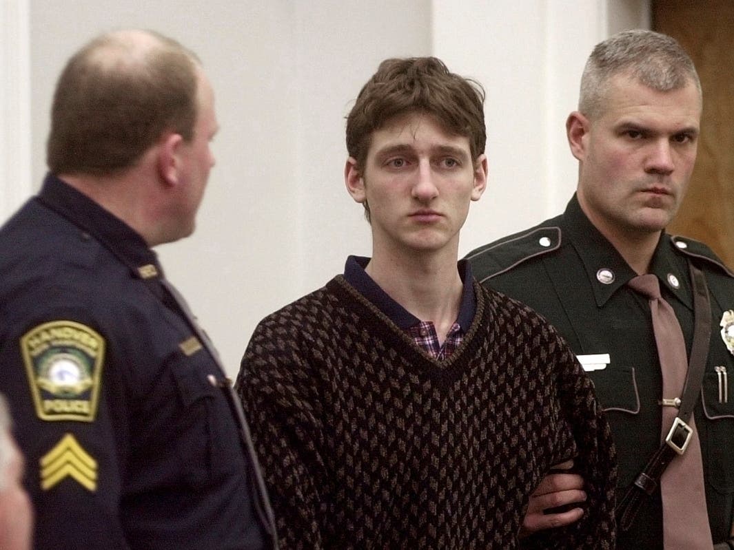 Robert Tulloch, 17, is escorted into Lebanon, N.H. District Court by Tropper James Stienmetz, right, and Hanover Sgt. Jeffrey Fleury, Feb. 21, 2001.