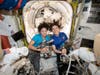 In this photo released by NASA on Thursday, Oct. 17, 2019, U.S. astronauts Jessica Meir, left, and Christina Koch pose for a photo in the International Space Station. 
