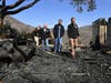 L.A. City Councilman Mike Bonin, California Governor Gavin Newsom and L.A. City Mayor Eric Garcetti tour a burned home along Tigertail Road in Brentwood, California on Tuesday.