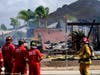 Fire crews work the scene of a small plane crash, Monday, Oct. 11, 2021, in Santee, Calif. 