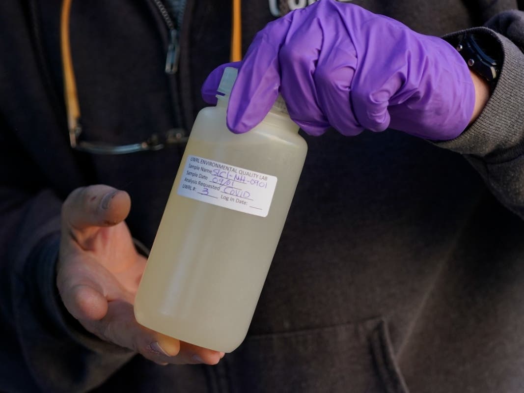 Ryan Dupont, Utah State University Professor of Civil & Environmental Engineering, collects sewage samples from the dorms at Utah State University Wednesday, Sept. 2, 2020, in Logan, Utah.