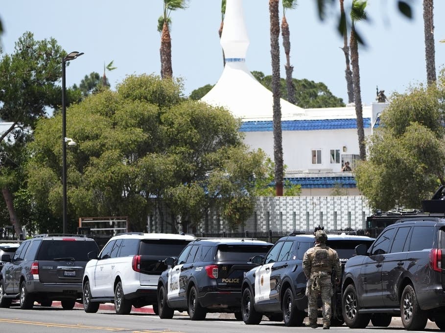 Police stage at the scene of a shooting outside the Islamic Center of San Diego Monday, May 18, 2026, in San Diego.