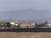 Crews work to douse a F-35 fighter jet that crashed near the run way at Marine Corps Air Station Miramar on Friday, July 31, 2026, in San Diego.