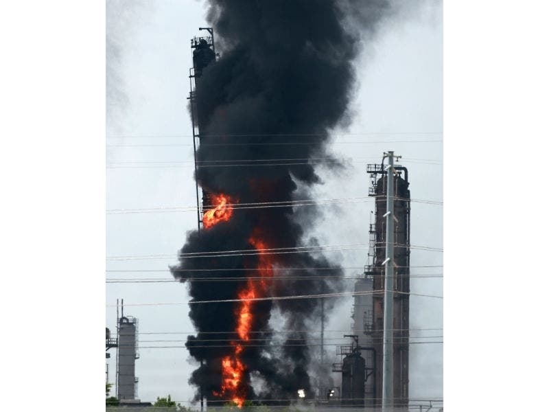 Flames and smoke rise after a fire started at an Exxon Mobil facility, Wednesday, July 31, 2019, in Baytown, Texas.