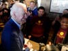 Democratic presidential candidate former Vice President Joe Biden (left) greets employees Tuesday at the Buttercup Diner during a campaign stop in Oakland, California.