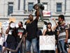 Jovan Brock leads a chant during a protest outside the Colorado State Capitol over the death of George Floyd, a handcuffed black man in police custody in Minneapolis.