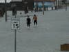 Two men walk on a flooded road as Hurricane Hanna makes landfall, Saturday, July 25, 2020, in Corpus Christi, Texas.
