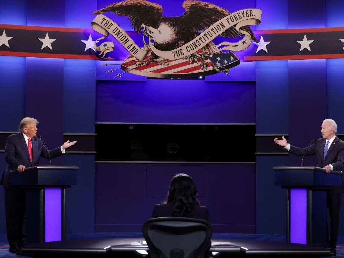 President Donald Trump and Democratic presidential candidate former Vice President Joe Biden walk on stage during the second and final presidential debate Thursday at Belmont University in Nashville.