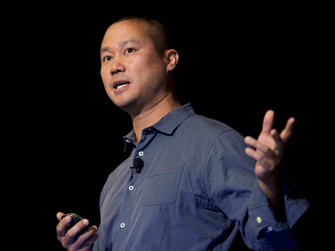 Tony Hsieh speaks during a Grand Rapids Economic Club luncheon in Grand Rapids, Michigan. Hsieh, the retired CEO of Las Vegas-based online shoe retailer Zappos, died Friday in Connecticut.
