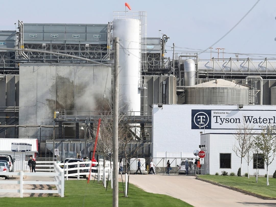 Tyson's Fresh Meat workers file in for a tour in May of safety measures put into place after the plant in Waterloo, Iowa, had to shut down due to a COVID-19 virus outbreak. 