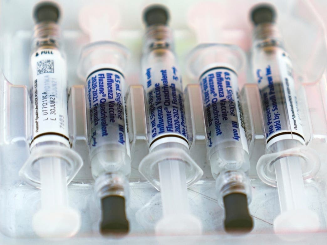 This file photo shows influenza vaccine syringes at the L.A. Care Health Plan and Blue Shield of California Promise Health Plan's Community Resource Center's Free Drive-Thru vaccination event in Los Angeles.
