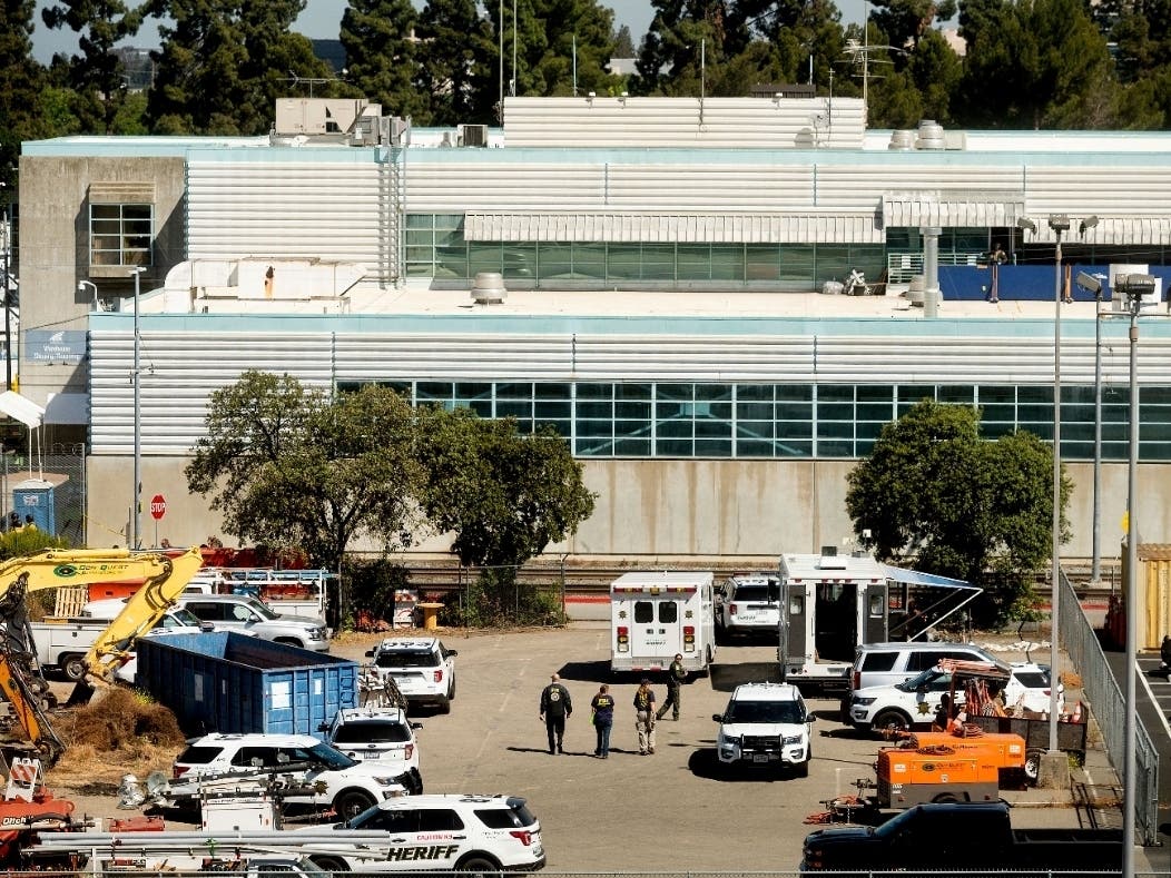 Law enforcement officers respond to the scene of a shooting at a Santa Clara Valley Transportation Authority facility on Wednesday in San Jose.