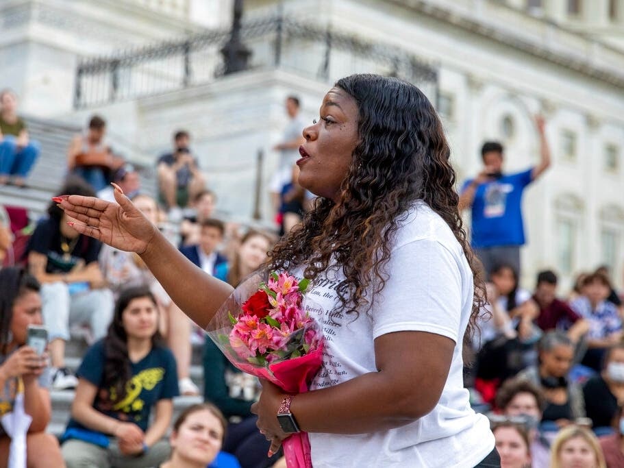 Rep. Cori Bush, D-Mo., speaks to crowds that attended a sit-in at Capitol Hill after it was announced the Biden administration will enact a targeted nationwide eviction moratorium outside of Capitol Hill in Washington.