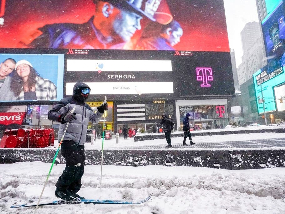 A person cross country skis through New York's Times Square during a snow storm on Saturday. 
