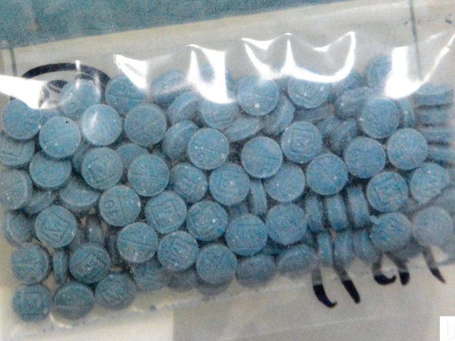 This undated photo made available by the U.S. Drug Enforcement Administration shows heroin fentanyl pills. Drug overdoses in New York City are on the rise — more than 1,200 people died of overdose in the first half of 2021.