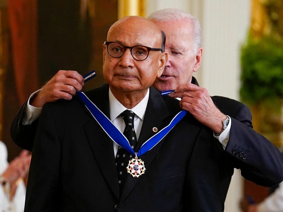 President Joe Biden awards the nation's highest civilian honor, the Presidential Medal of Freedom, to Khizr Khan at the White House in Washington. Khan, a Gold Star father, lives in Charlottesville.