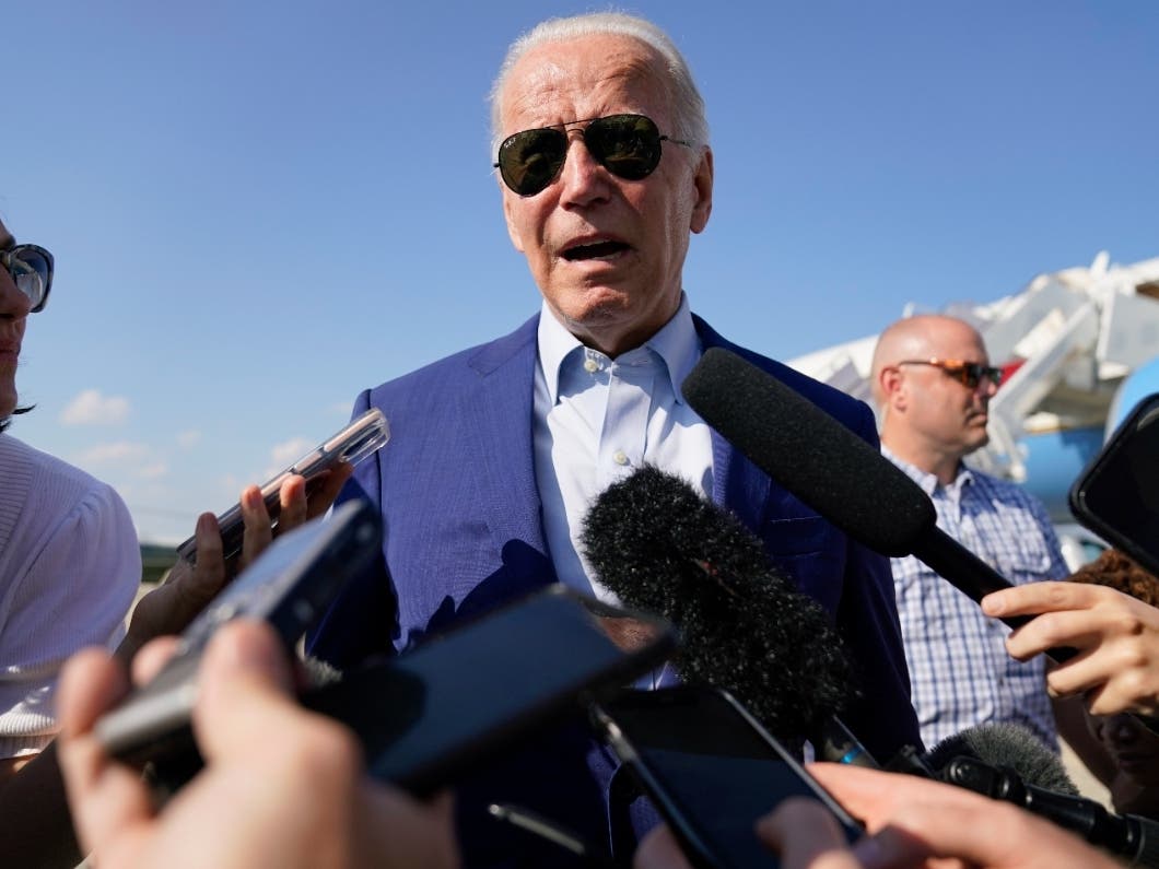 President Joe Biden speaks to members of the media after exiting Air Force One Wednesday at Andrews Air Force Base, Md. Biden tested positive for COVID-19 on Thursday.