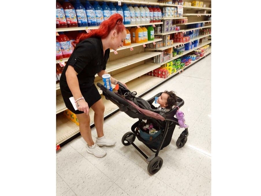 This undated photo shows Jazmin Valentine and her baby at a supermarket. Valentine filed a federal lawsuit Tuesday alleging that nurses and staff at the Washington County jail in Maryland ignored her as she gave birth to her daughter there in July 2021.