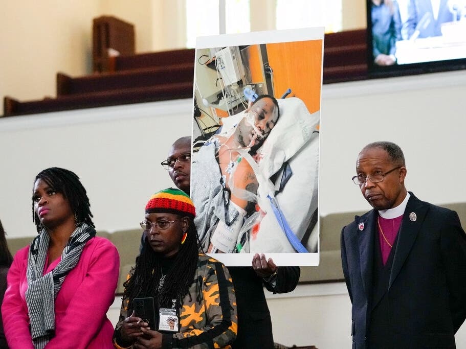 Family members and supporters hold a photograph of Tyre Nichols at a news conference in Memphis, Tenn. DC police are "fully activated" ahead of Friday's release of police video depicting five Memphis officers beating Nichols.