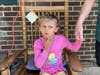Kinsley White, 6, shows reporters a wound left on her face. Robert Louis Singletary, 24, is accused of shooting Kinsley and two others outside his Gastonia, North Carolina, home on Tuesday.