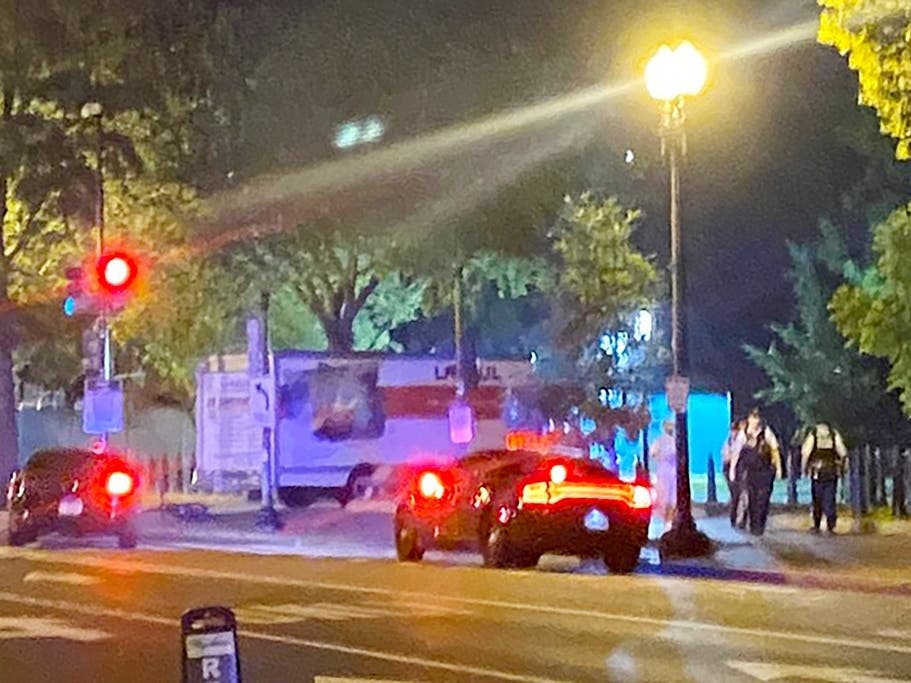 A box truck is seen crashed into a security barrier at a park across from the White House, Monday night. Police have arrested a man they believe intentionally crashed a U-Haul truck into a security barrier near the north side of Lafayette Square.