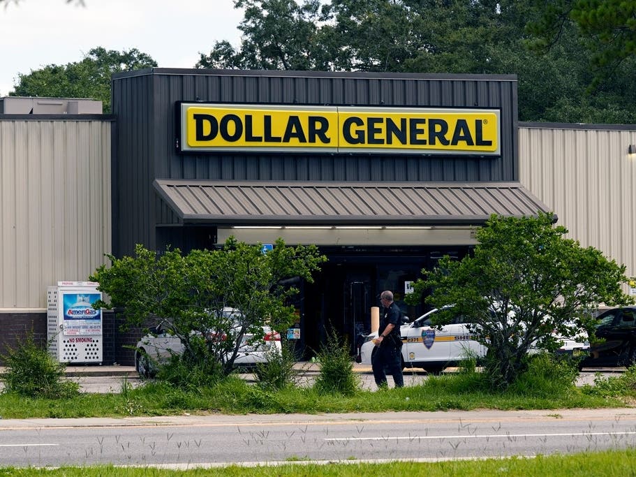 Law enforcement officials continue their investigation at a Dollar General Store that was the scene of a mass shooting on Aug. 27 in Jacksonville.