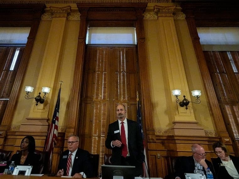Georgia's State Election Board members discuss proposals for election rule changes at the state capitol on Friday in Atlanta.
