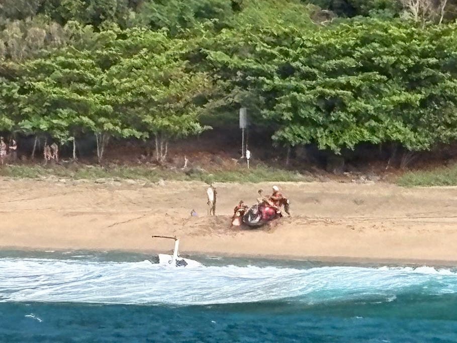 A sightseeing company's helicopter crashed near a remote beach off the coast of the Hawaiian island of Kauai, killing three people and injuring two others.