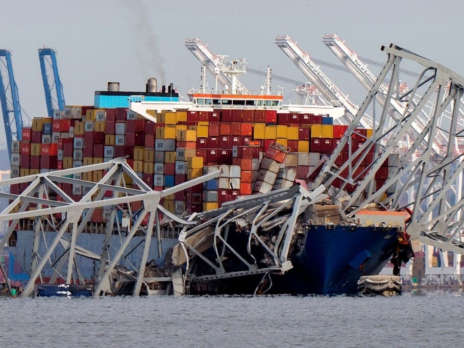 The cargo ship Dali is stuck under part of the Francis Scott Key Bridge after the ship hit the bridge on March 26, 2024, as seen from Pasadena.