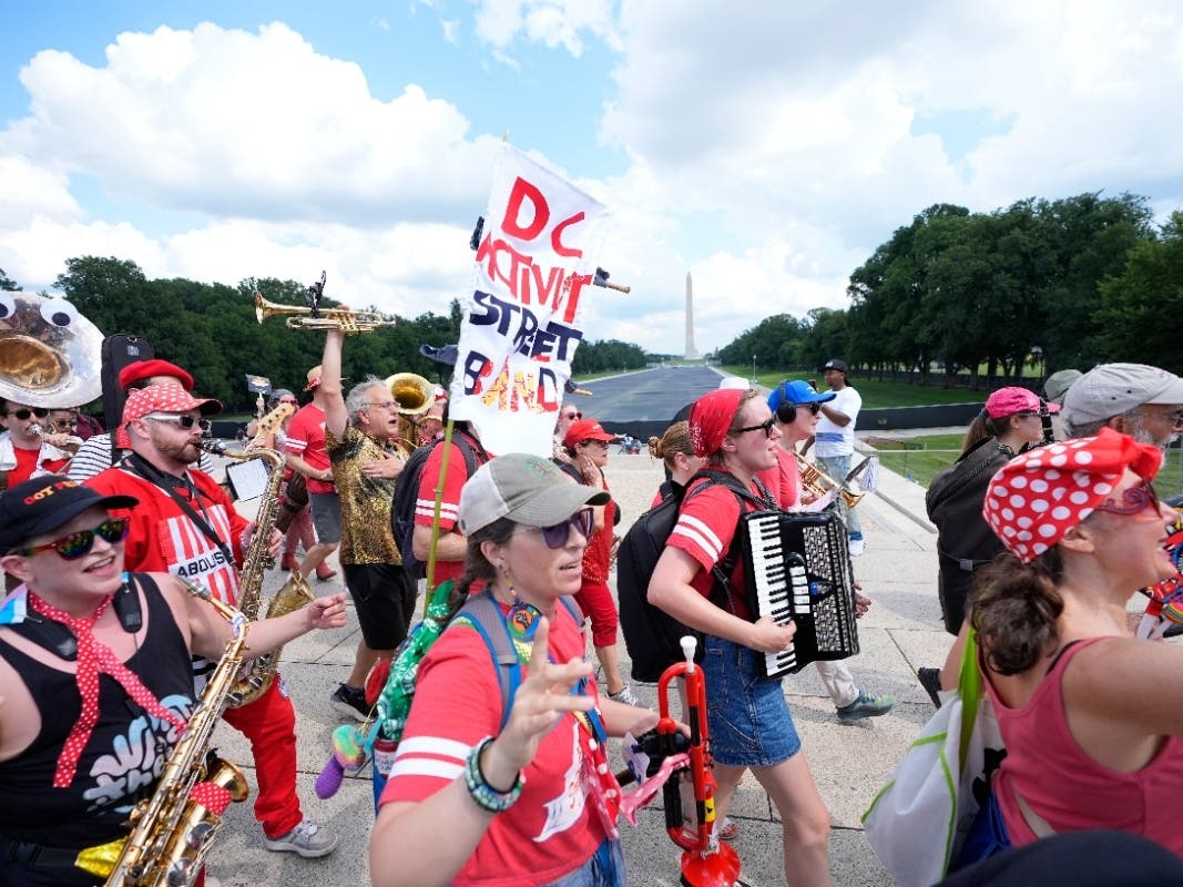 A group of local activists from Washington, D.C., demonstrating during the March on Washington rally at the Lincoln Memorial on the National Mall, Friday, Aug. 28, 2026.
