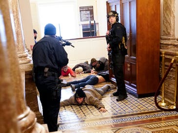 U.S. Capitol Police hold protesters at gun-point near the House Chamber inside the U.S. Capitol on Wednesday, Jan. 6, 2021, in Washington.