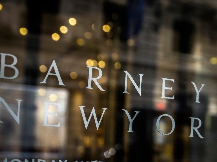 Signage for Barneys New York department store is displayed on the store's window, Tuesday July 16, 2019. 