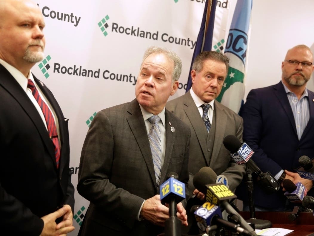 Rockland County Executive Ed Day, second from left, speaks Dec. 30, 2019 about increased security at synagogues that feel threatened and the use of a private security firm offering to help.
